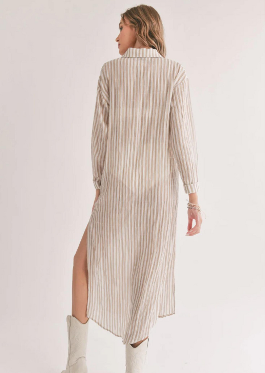 Sadie & Sage Sands Thin Stripe Duster Shirt. Introducing the Sands Thin Stripe Outer Layer Duster Shirt, a versatile piece that combines comfort and style effortlessly. This shirt features a slim fit and lightweight fabric for maximum breathability, perfect for staying cozy by the pool.