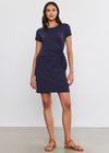 Velvet Alma Cotton Slub Side Tie Dress. A mini length, short sleeve cotton slub dress. Designed with a side tie detail that cinches the waist and elevates this essential piece. Pair with a denim jacket and boots, layer under a cardigan, or wear alone with strappy sandals.
