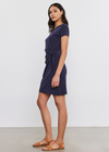 Velvet Alma Cotton Slub Side Tie Dress. A mini length, short sleeve cotton slub dress. Designed with a side tie detail that cinches the waist and elevates this essential piece. Pair with a denim jacket and boots, layer under a cardigan, or wear alone with strappy sandals.
