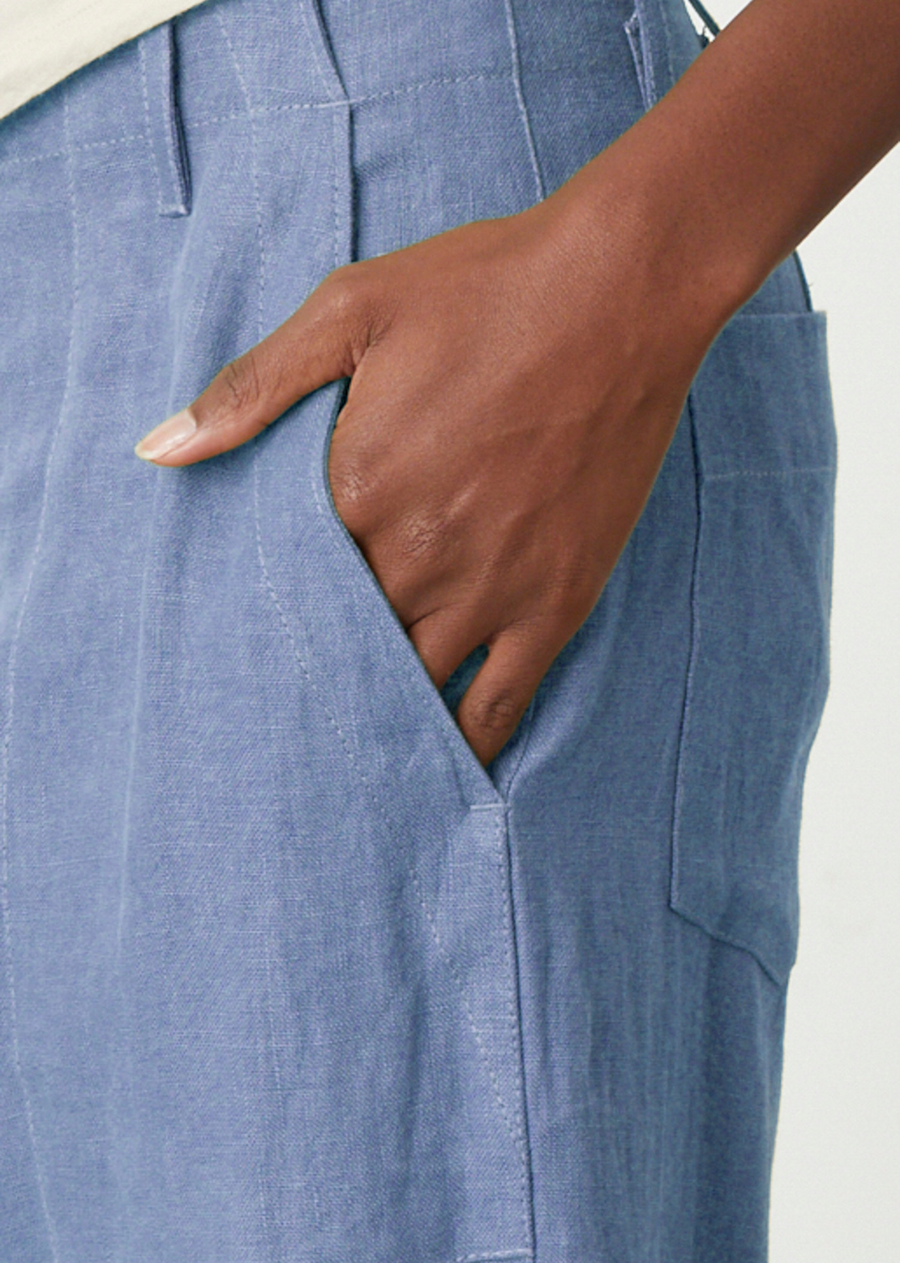Velvet Dru Heavy Linen Pant- Blue Haze. Stay cool and stylish in this heavy linen pant. Crafted from a heavier linen fabric, these cropped, wide leg pants feature a button and zipper closure, slash pockets, and patch pockets for a classic, timeless look.