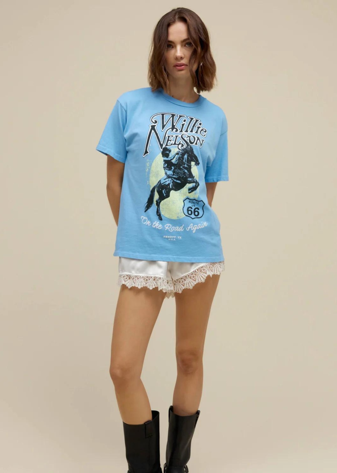 DayDreamer LA Willie Nelson Route 66 Weekend Tee. Lean into your western ways on Route 66 in a new Willie Nelson weekend tee. Shouting out one of Nelson’s biggest hits “On the Road Again” with a bucking horse graphic. Ranking in with a high styling versatility score.