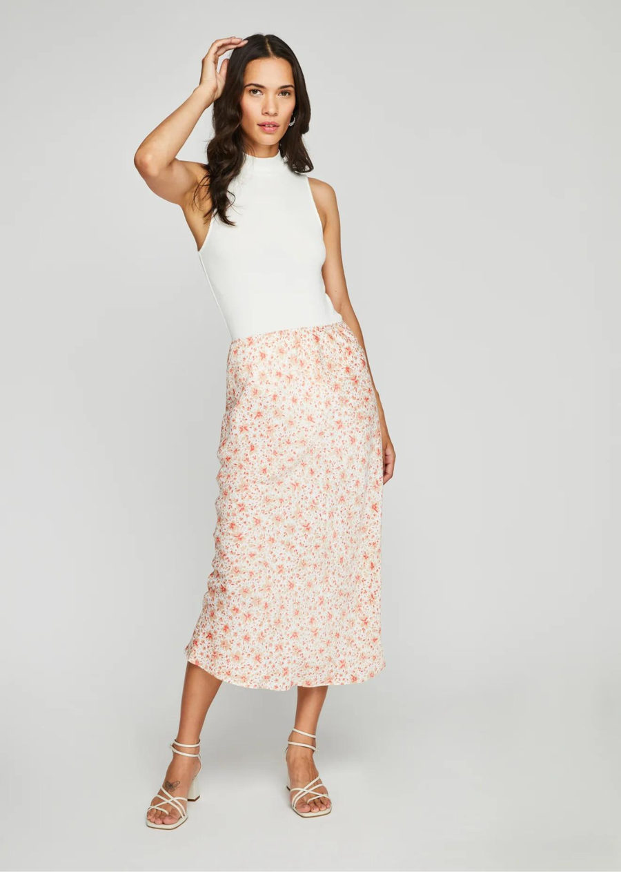 Gentle Fawn Florentine Skirt-White Ditsy. The Florentine skirt is made of satin fabric with a print designed in-house. The skirt is bias-cut for a flattering fit and features an elastic waistband with delicate scallop trim along the top edge.