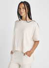 Splendid Veronica Tunic Sweater.The Veronica Tunic Sweater has a cropped, easy fit with a silky smooth hand feel. We love how the boxy relaxed fit pairs with the elevated details like the rib hem and side slits.