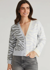 525 America Nicole Jacquard Boxy Cardi. Introducing the Nicole Colorblock Zebra Print Cardigan. Made with a button-up closure, this playful cardigan features a unique zebra print and colorblock design. The boxy fit offers both comfort and fashion-forward style. Elevate your wardrobe with some color on your everyday outfits.