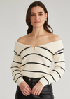 525 America Sierra Stripe Off Shoulder Pullover. Stand out with this stylish pullover featuring a striped design and an adjustable zippered neckline. Customize the off-shoulder look to your preference for a chic, versatile style.