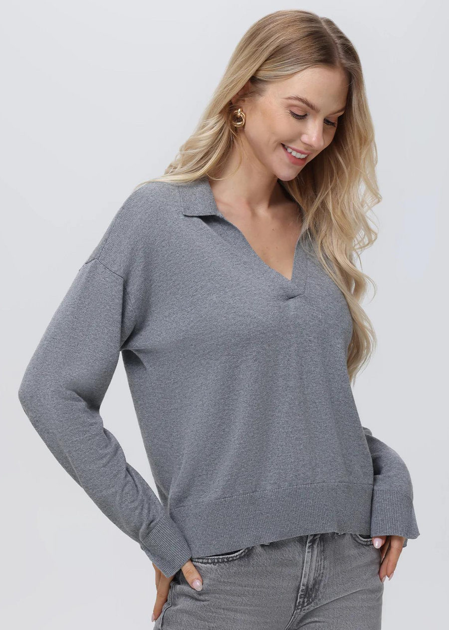 525 America Maddi: V-Neck Collar Pullover- Smoked Grey.Introducing Maddi: the perfect lightweight pullover for any season. Crafted with a classic Johnny collar and V-neck, this pullover is made of a breathable and lightweight fabric with ribbed hem for an outstanding fit. Quality and style combined.