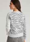 525 America Nicole Jacquard Boxy Cardi. Introducing the Nicole Colorblock Zebra Print Cardigan. Made with a button-up closure, this playful cardigan features a unique zebra print and colorblock design. The boxy fit offers both comfort and fashion-forward style. Elevate your wardrobe with some color on your everyday outfits.