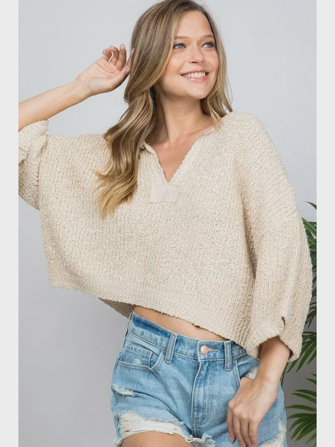 Our signature slouchy cropped sweater featuring v-neckline, 3/4 sleeves, and solid patch at front and back. Wearable all year round.