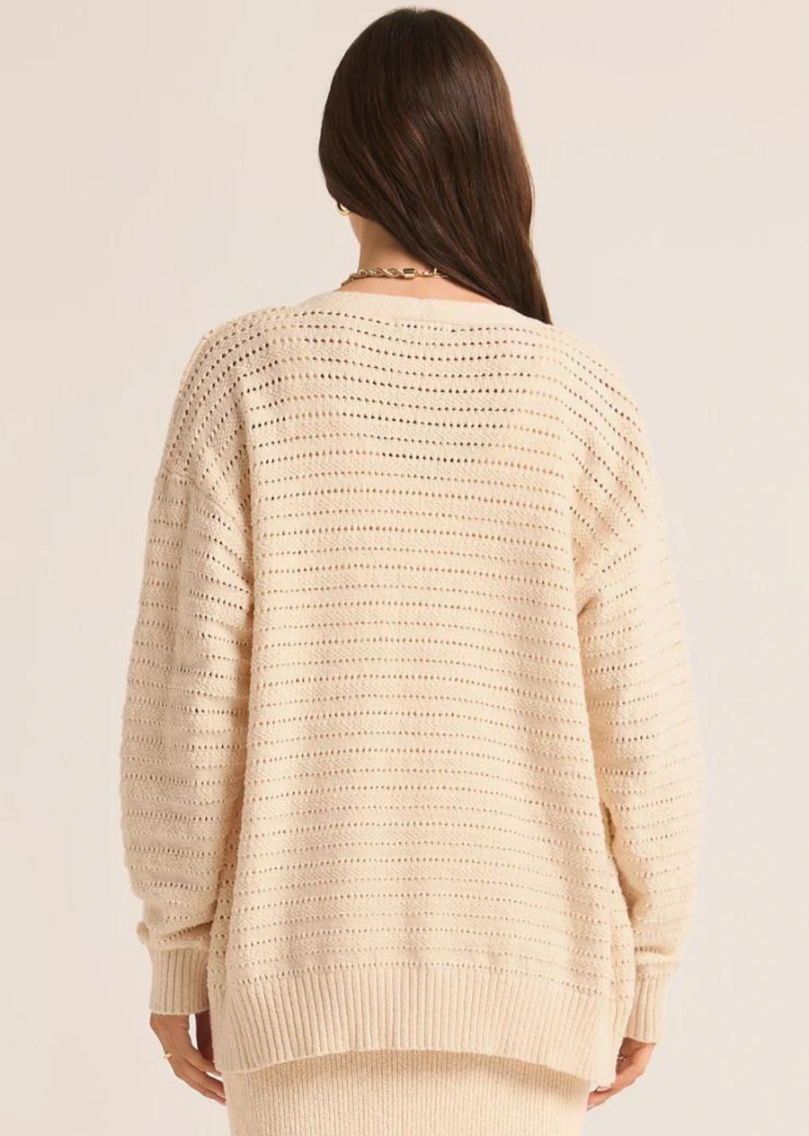 Z Supply Arcadia Pointelle Cardigan. Meet our new cozy relaxed cardigan featuring a charming novelty pointelle stitch, complemented by rib detailing and full-length sleeves for added warmth. With a convenient button-front design, it's the perfect layering piece to effortlessly elevate your look.