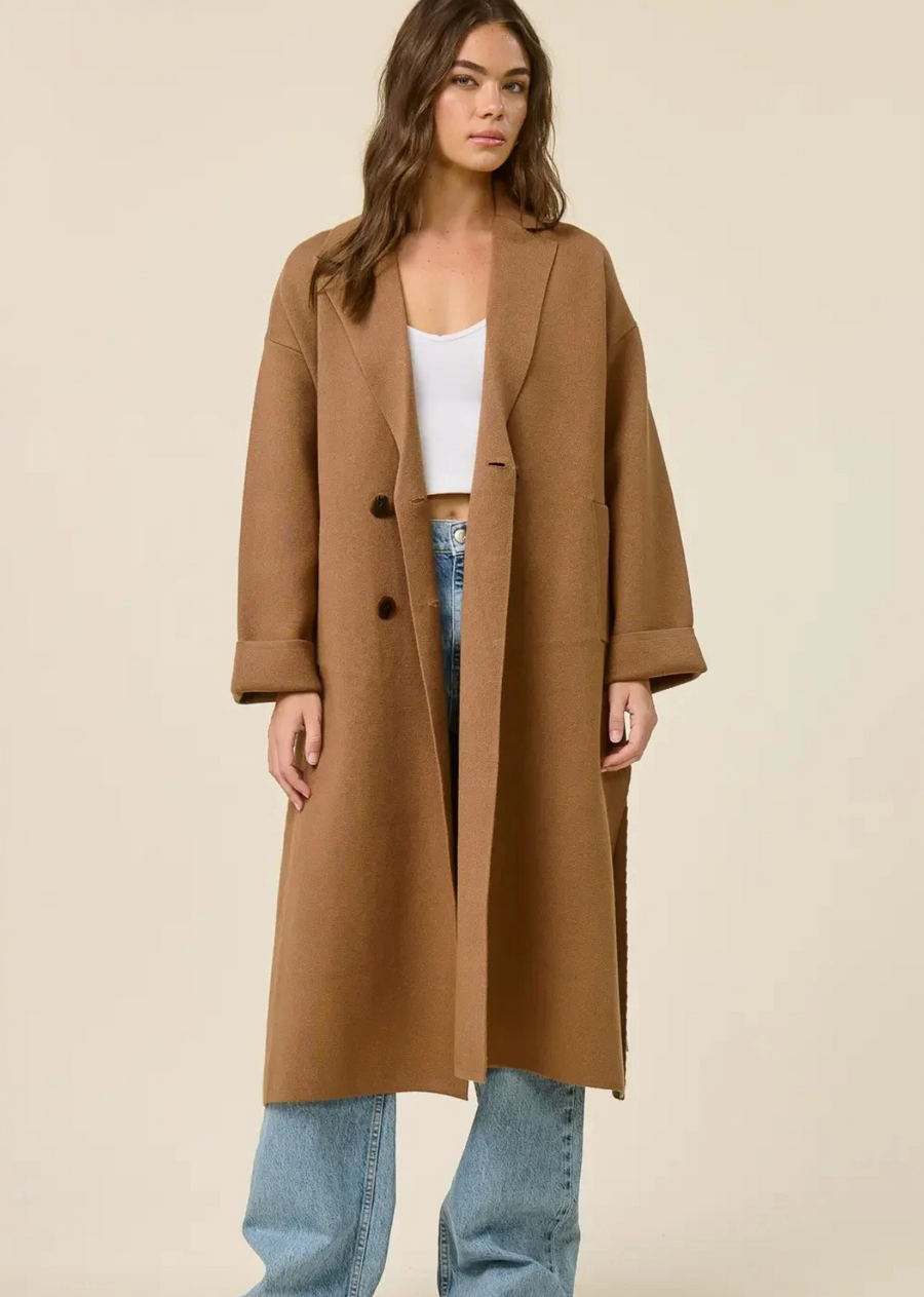 Experience timeless elegance with this sophisticated belted coat.

Crafted from a luxurious wool blend, this outerwear piece offers exceptional warmth and a premium feel. This long coat exudes classic charm, making it a versatile addition to any wardrobe. Featuring a flattering lapel collar and a chic double-breasted design, this coat is designed to impress. The adjustable belt cinches at the waist, creating a beautiful silhouette and adding a touch of refined style
