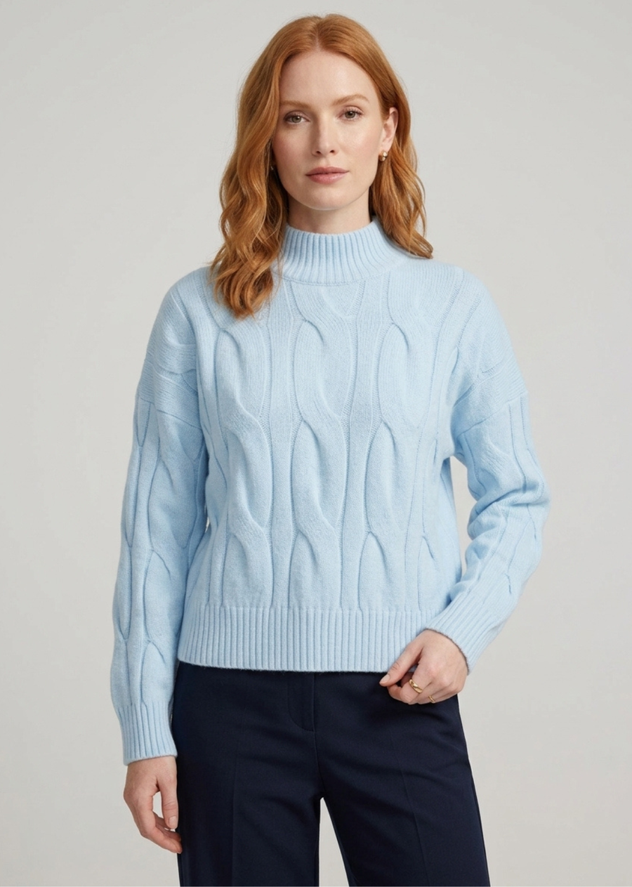 The Etta Mock is a refined mock neck top designed in a soft light pink knit. Featuring a close neckline, fitted shape, and soft ribbed texture, it brings a refined western edge to everyday styling. An easy piece to style with denim, tailored pants, or a feminine skirt.