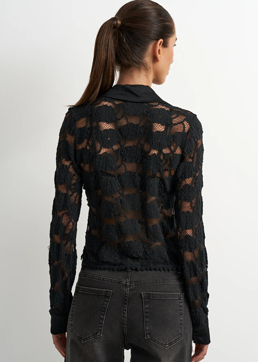 The Heritage Blouse is a feminine blouse designed in a textured black lace. Featuring delicate texture, a feminine finish, and a refined silhouette, it brings a refined western edge to everyday styling. An easy piece to dress up with tailored pants or style as a matching set.