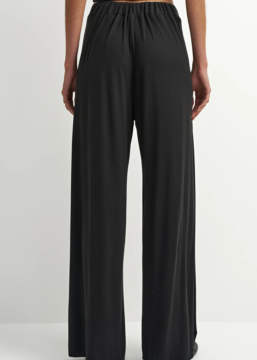 The Maeve Pant is a polished pant designed in a black stretch fabric. Featuring a flattering waist, clean leg, and polished drape, it brings a refined western edge to everyday styling. An easy piece to pair with a soft knit, blouse, or matching jacket.