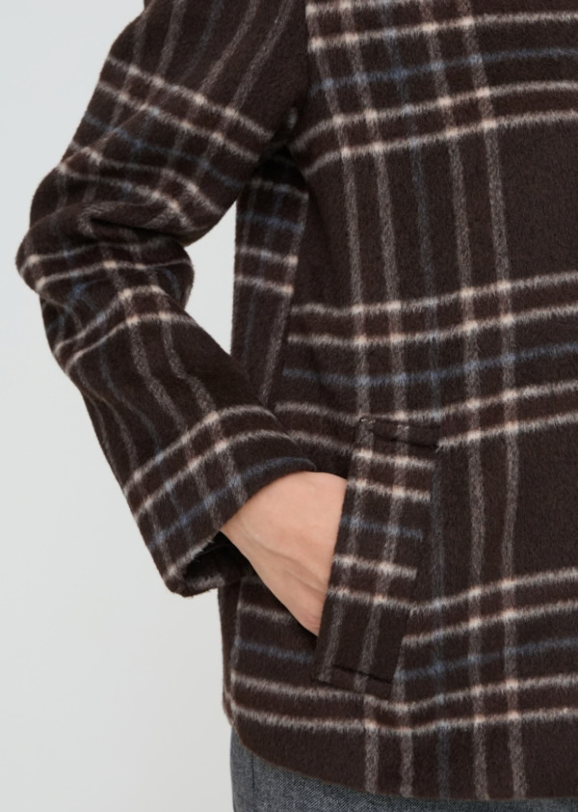 Wool look check jacket features a straight, slightly boxy silhouette with a pointed collar and button front. Hip-length design includes long sleeves and side pockets, offering a softly structured shape with a fuzzy texture throughout.