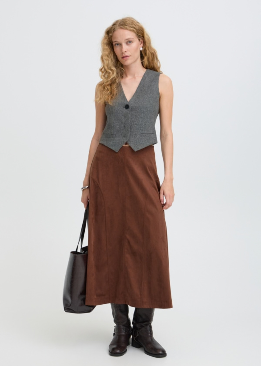 Elevate your tailoring game with this sharp, sophisticated grey melange waistcoat vest. Blending classic menswear chic with a flattering feminine cut, this versatile vest brings instant structure and modern refinement to any outfit.