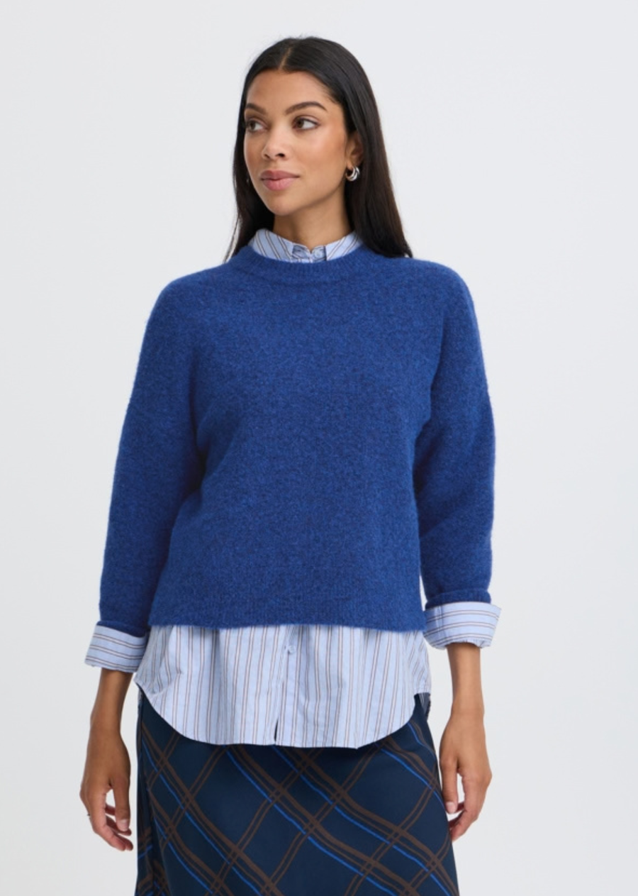 Brighten up your cold-weather collection with this vibrant, ultra-cozy crew neck jumper in a striking blue depths melange. Designed with a soft, fuzzy texture and a relaxed silhouette, this knit adds a pop of rich colour while delivering everyday comfort and style.&nbsp; Classic crew neckline, dropped shoulders for a laid-back drape, and ribbed trim along the collar, cuffs, and hem.