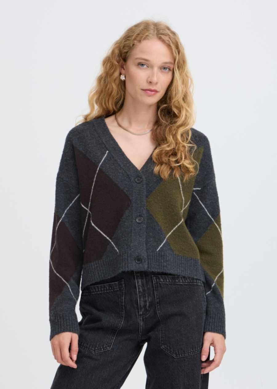 A modern twist on a heritage classic, this oversized argyle cardigan offers street-style sophistication with vintage-inspired charm. Featuring a bold geometric color-block pattern in rich moody tones and clean white line work, this cardigan is designed for effortless off-duty layering. V-neckline with a tonal button-front closure and drop-shoulder long sleeves.
