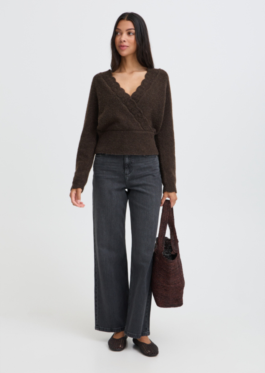 Cozy knitwear meets romantic design. Rendered in a rich Java Melange brown, this soft wrap-front sweater features a delicate scalloped edge along the deep V-neckline for a feminine touch. Finished with a wide ribbed hem band that defines the waist and long sleeves, it’s an effortlessly chic statement piece for cool autumn days.