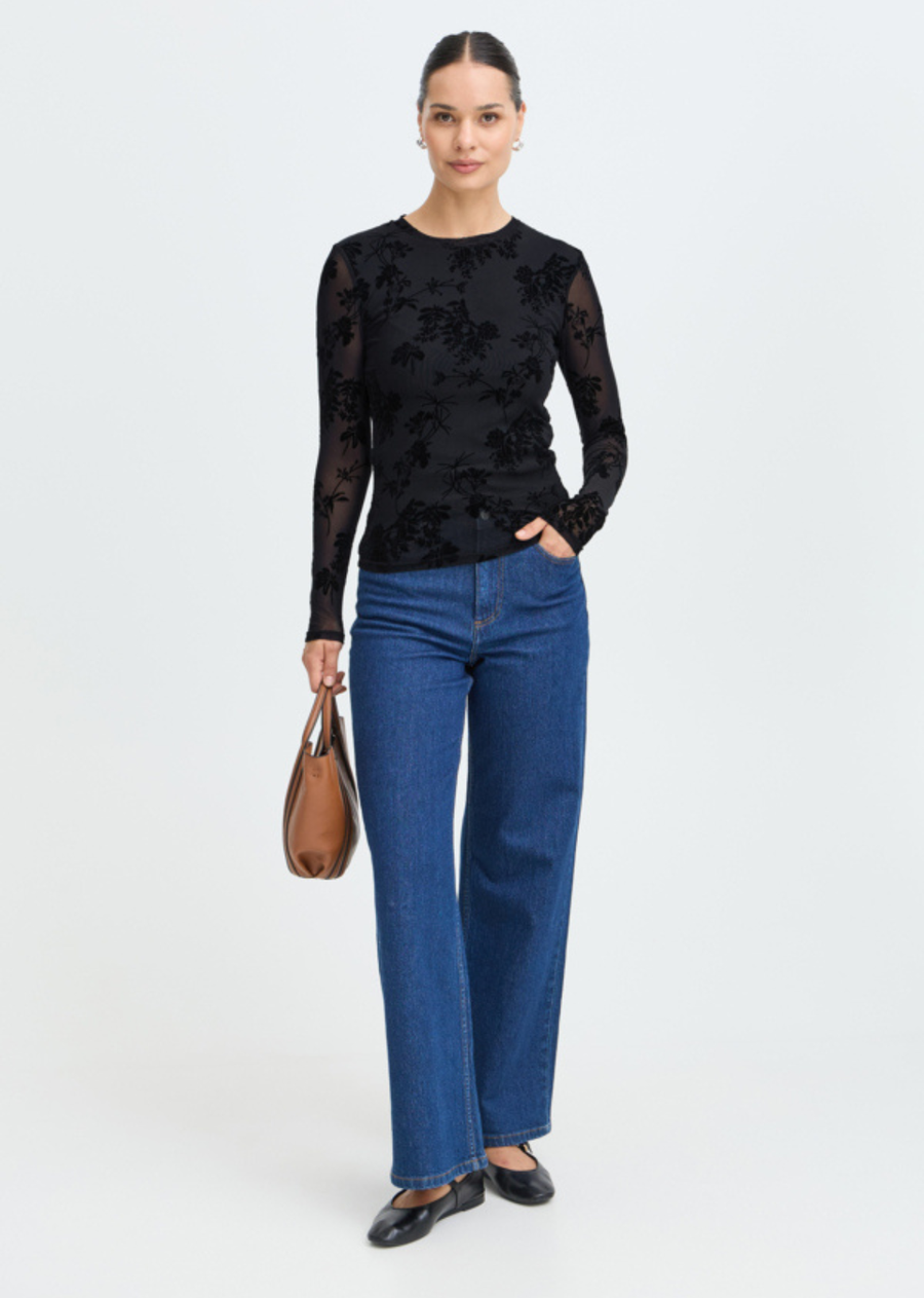 Add rich texture and visual interest to your evening and day looks with this sheer floral top. Featuring flocking floral motifs layered over lightweight mesh, it offers a fitted silhouette with a flattering crew neckline and long, fitted sleeves. Designed for effortless layering, it pairs seamlessly over a simple cami or structured bra, making it an essential piece for going out or styling under fall jackets.