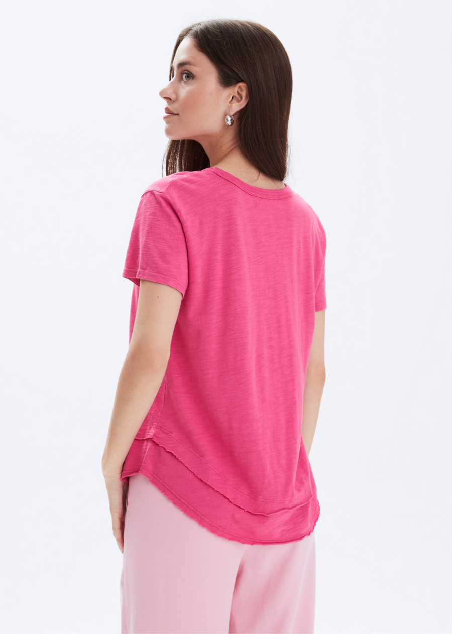 CHRLDR Ava Mock Neck T-Shirt- Strawberry Pink.Fits true to size Pima Cotton/Modal Slub Jersey Smooth buttery feel Mock Layers detail at the bottom Clean finish Wash cold Made in Peru.