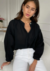Charli Maya Blouse-Black. Romantic soft cotton voile blouse with mandarin collar is an easy way to elevate your off duty look. Relaxed fit with balloon sleeves makes a great styling foundation piece that can be teamed with denim or higher waisted trousers. Pearl buttons give a luxe feel to a versatile wardrobe classic.