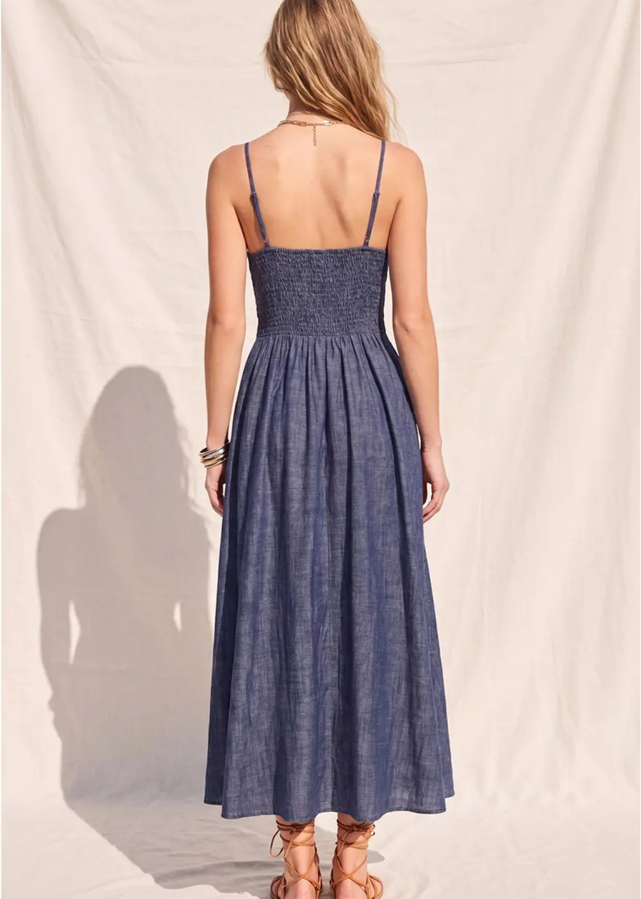 Bring timeless feminine style to your wardrobe with The Charlotte Fit &amp; Flare Midi Dress. Designed with a flattering denim silhouette, this dress features a classic V-neckline, structured corset waist detailing, and a fit-and-flare shape that beautifully defines the figure. The smocked back panel offers a comfortable, flexible fit, while adjustable shoulder straps allow for a customizable feel. Finished with a full lining for added comfort, this effortlessly chic midi dress is perfect for brunch dates, 