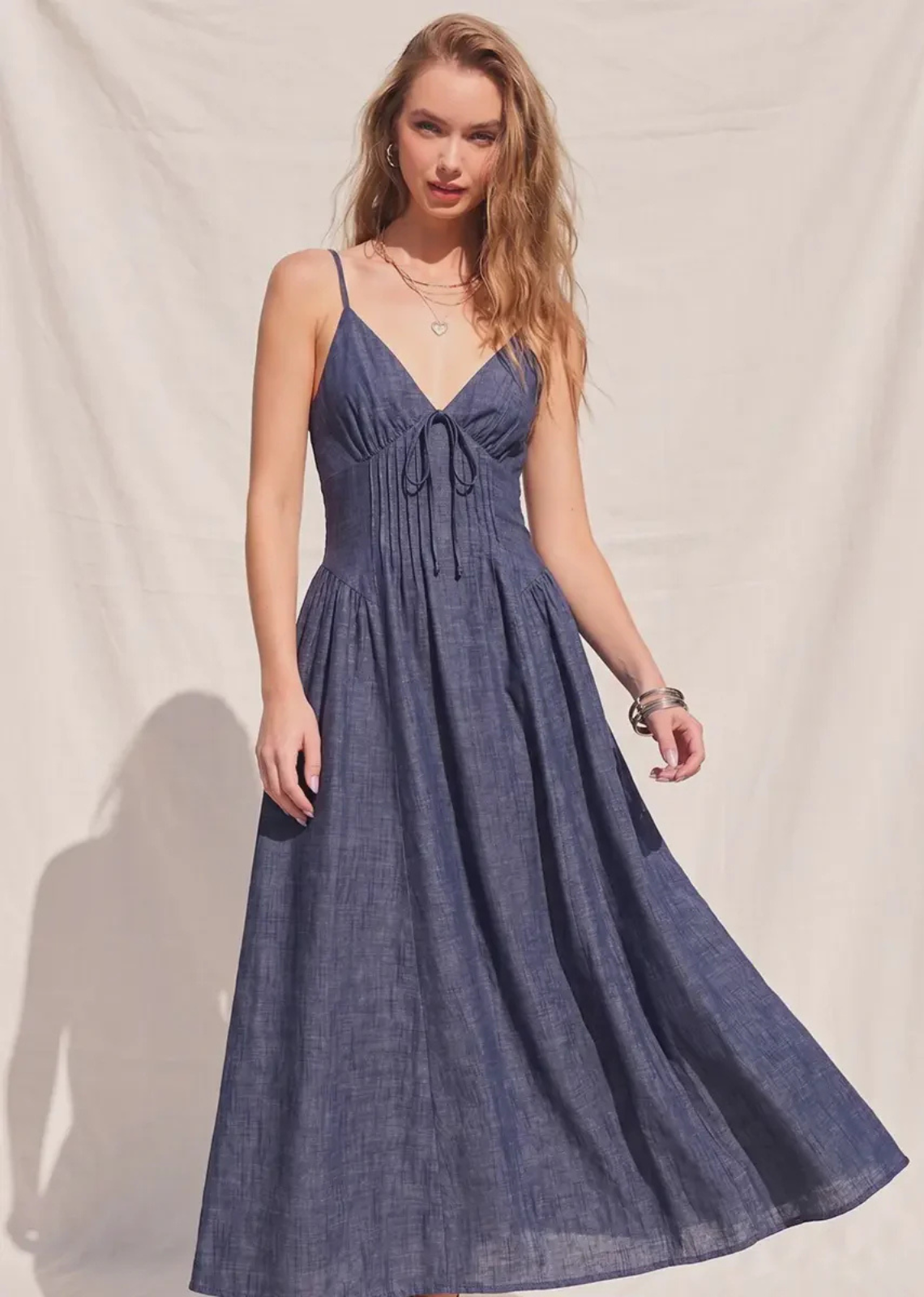 Bring timeless feminine style to your wardrobe with The Charlotte Fit &amp; Flare Midi Dress. Designed with a flattering denim silhouette, this dress features a classic V-neckline, structured corset waist detailing, and a fit-and-flare shape that beautifully defines the figure. The smocked back panel offers a comfortable, flexible fit, while adjustable shoulder straps allow for a customizable feel. Finished with a full lining for added comfort, this effortlessly chic midi dress is perfect for brunch dates, 