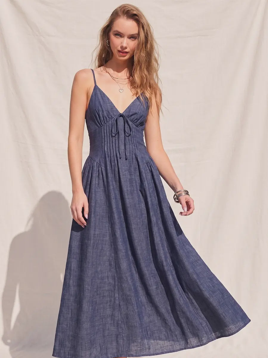 Bring timeless feminine style to your wardrobe with The Charlotte Fit &amp; Flare Midi Dress. Designed with a flattering denim silhouette, this dress features a classic V-neckline, structured corset waist detailing, and a fit-and-flare shape that beautifully defines the figure. The smocked back panel offers a comfortable, flexible fit, while adjustable shoulder straps allow for a customizable feel. Finished with a full lining for added comfort, this effortlessly chic midi dress is perfect for brunch dates, 