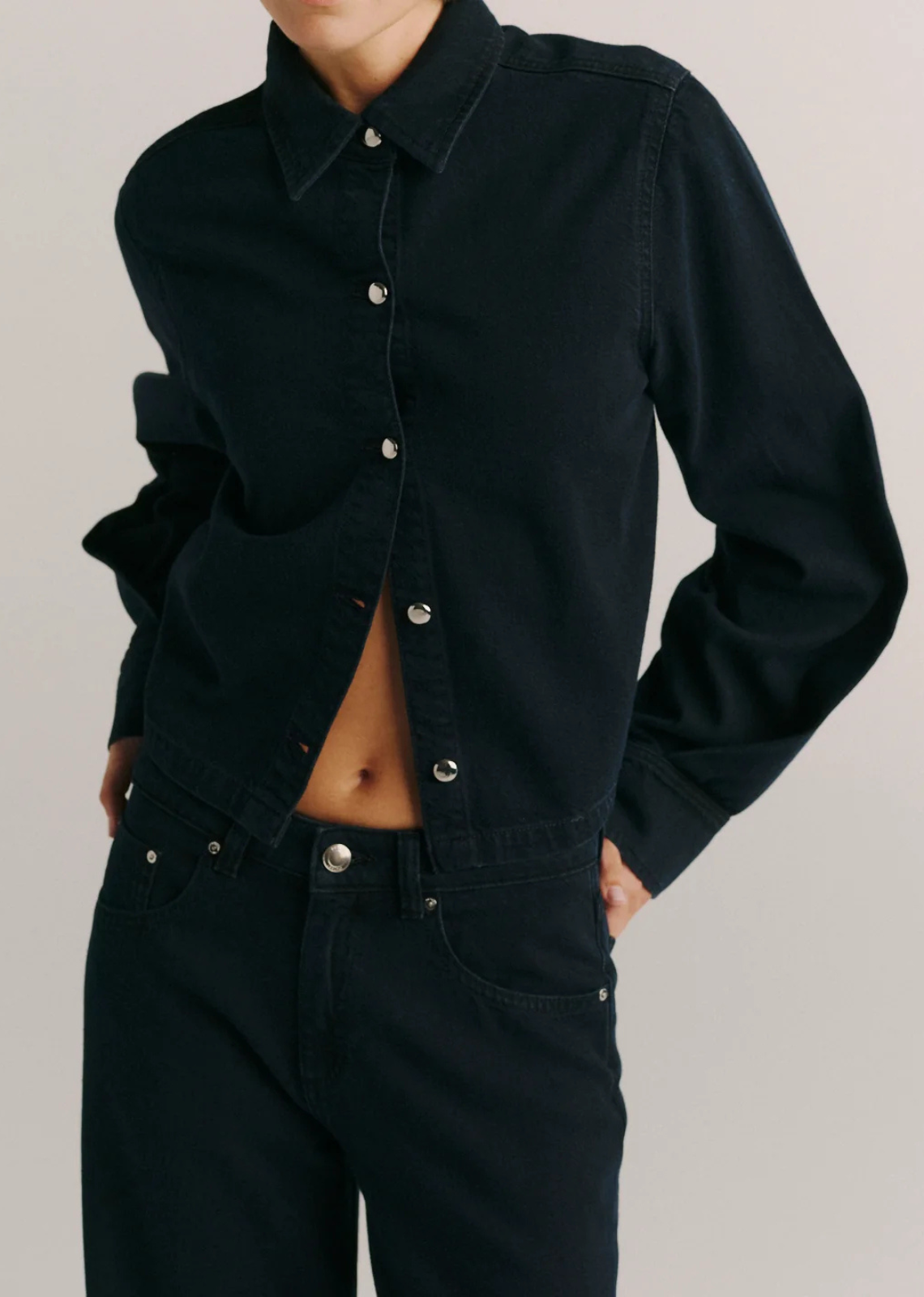 Montauk is s a long sleeve, button down shirt with a boxy fit that is subtly cropped.

Nightfall Aura is a dark, polished rinse. It features silver hardware, tonal stitching and a clean hem.