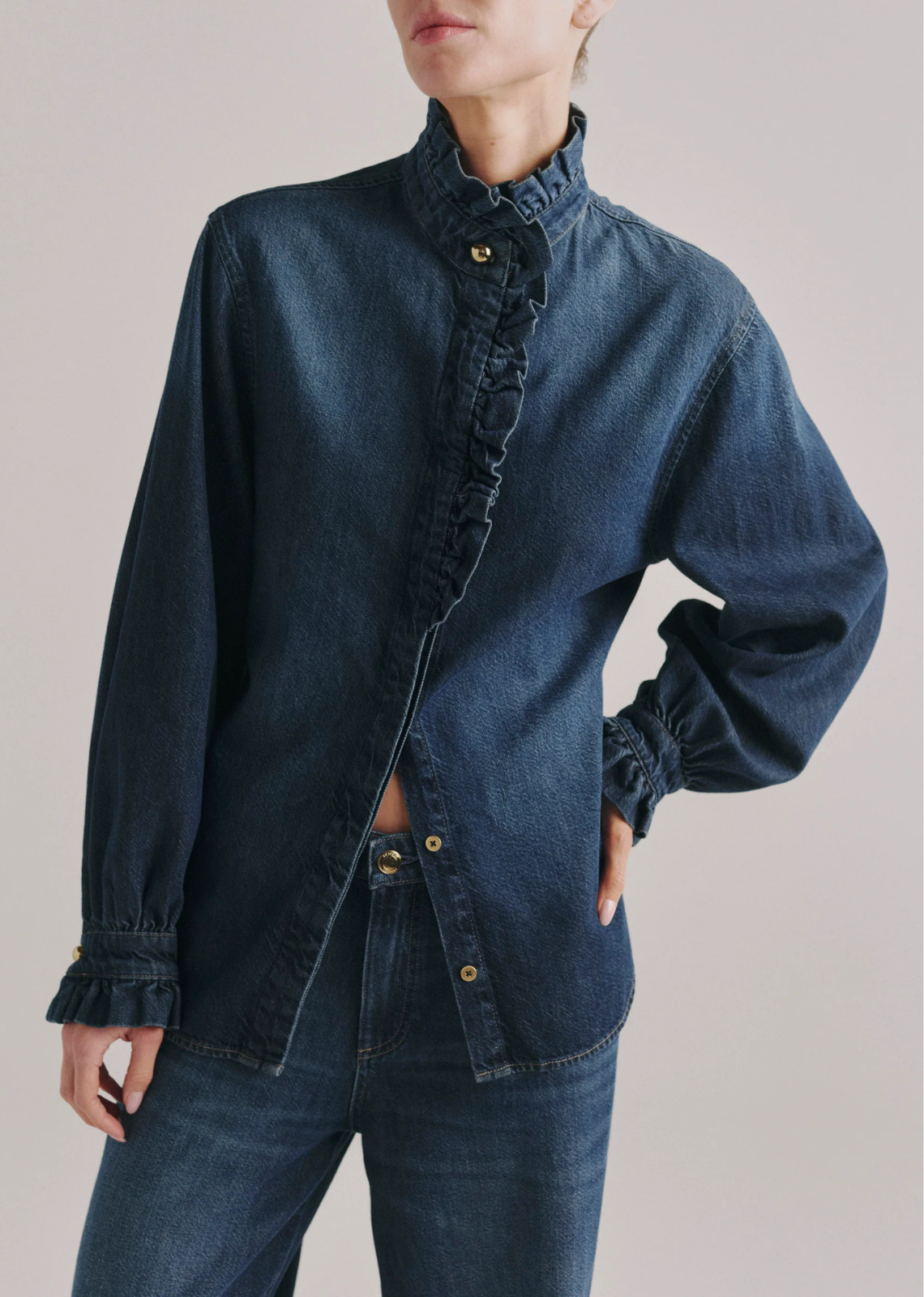 The Ruffle Shirt is an elegant, tailored button-down with ruffles along the collar, placket, and cuffs.

Fall Blues Aura is a timeless mid-wash denim. It features gold hardware, khaki stitching and a clean hem.