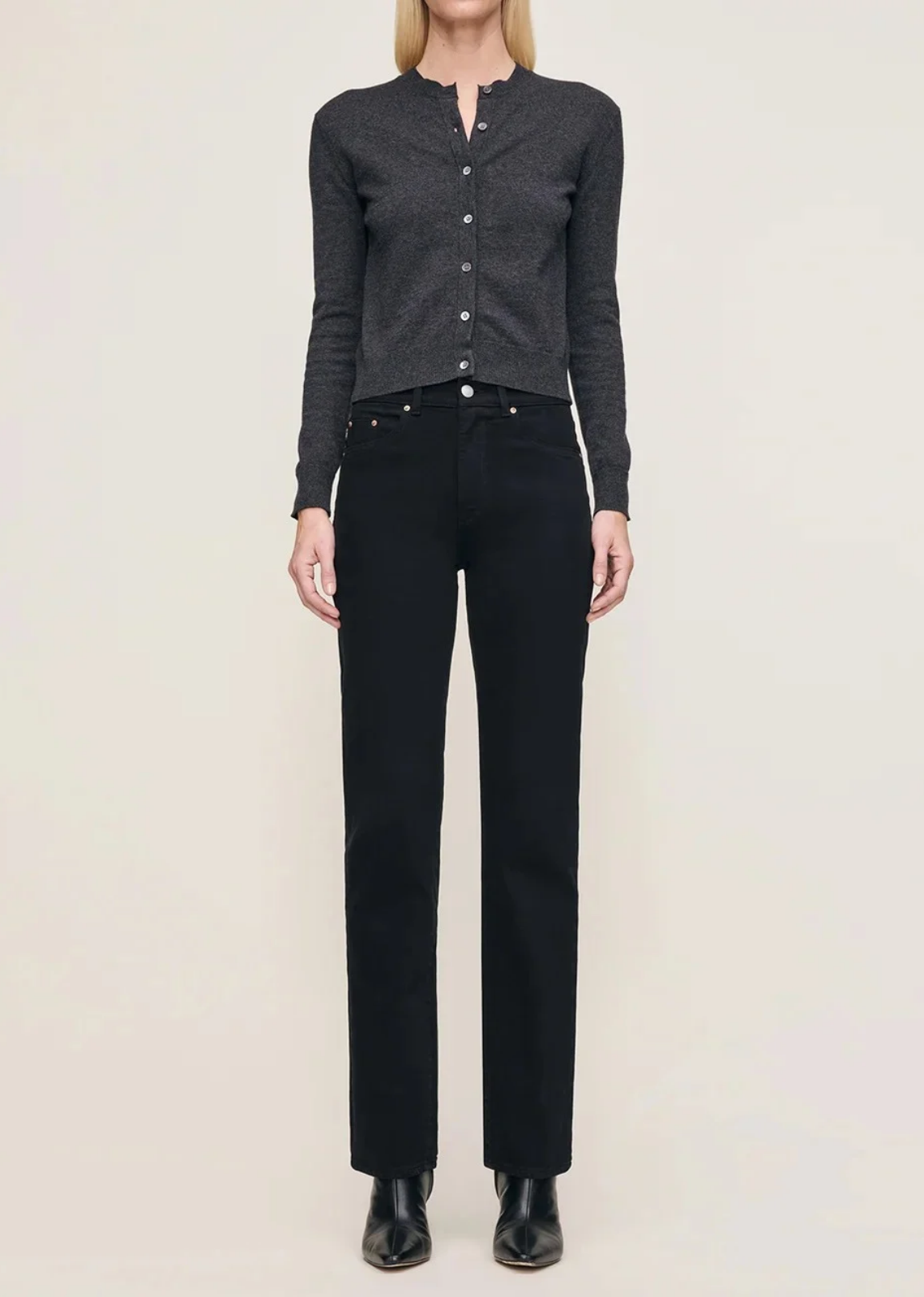 Patti high-rise vintage straight-leg jeans in true black denim, featuring a relaxed fit through the leg, five-pocket construction, silver shank, copper rivets, tonal stitching, a clean hem, and a black back patch. Made with cotton, recycled cotton, and Lycra for a comfortable touch of stretch, with a 31-inch inseam.