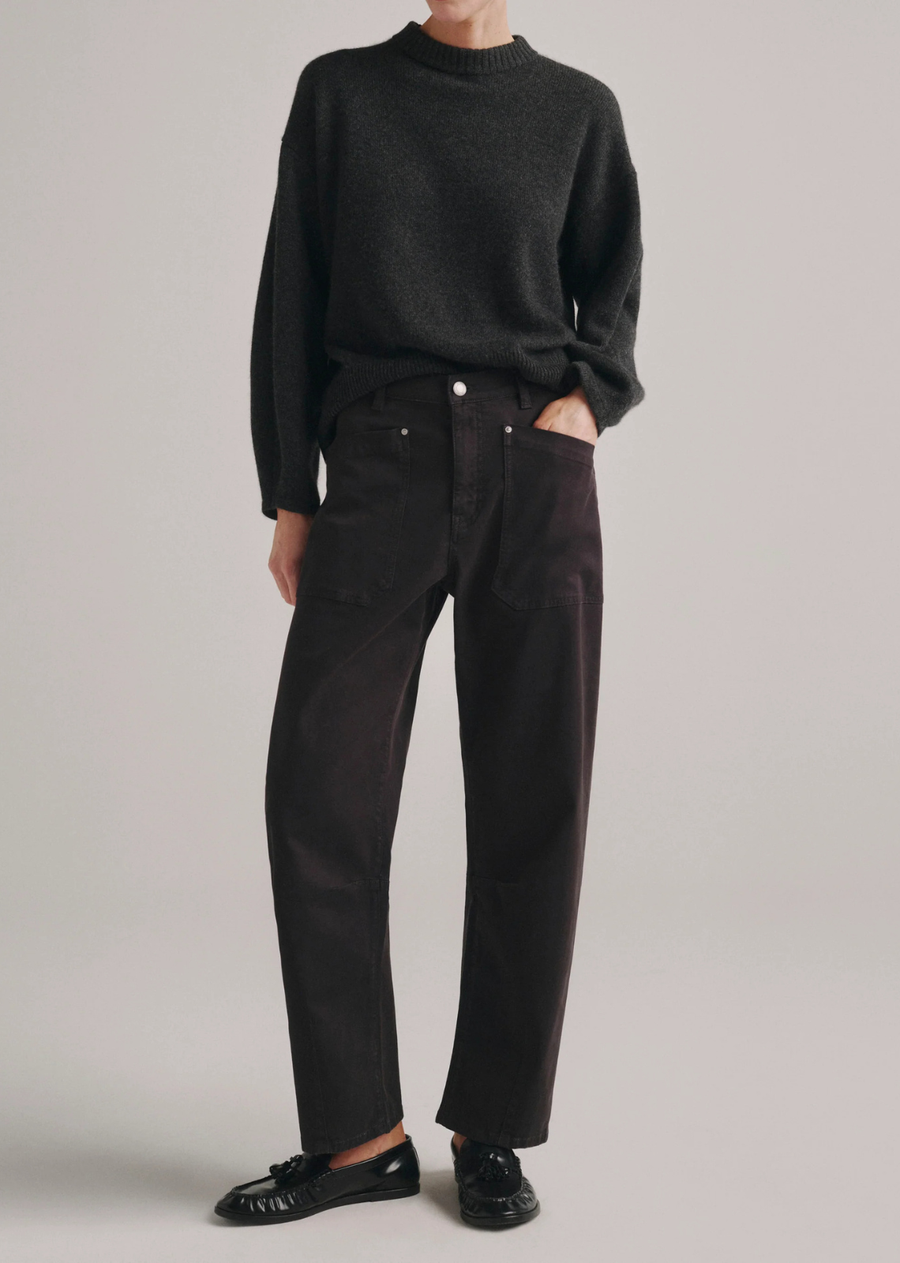 Bilie is a high-rise, easy barrel fit that hits above the ankle, showcasing darts for a structured and shaped look.

Dark Cinder is deep, charcoal-like gray with a slightly brown undertone. It features silver hardware, tonal stitching, a clean hem and a black back patch.