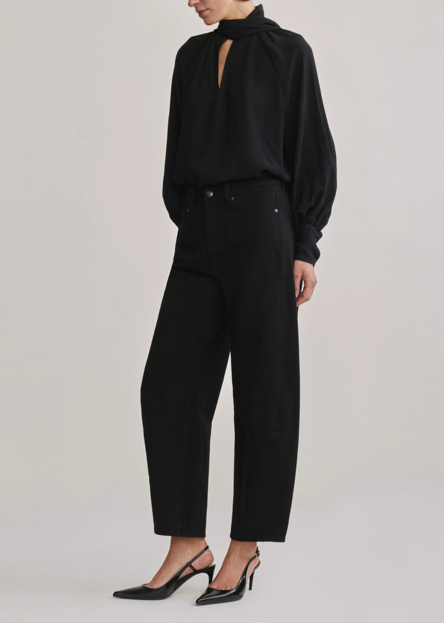 Miro is a high-rise, true barrel leg jean that is fitted at the hip and hits at ankle length, tapering at the leg.

Black is a true black denim. It features silver hardware, tonal stitching, a clean hem and a black back patch.