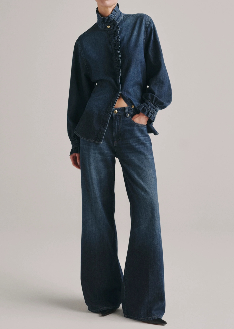 The Ruffle Shirt is an elegant, tailored button-down with ruffles along the collar, placket, and cuffs.

Fall Blues Aura is a timeless mid-wash denim. It features gold hardware, khaki stitching and a clean hem.