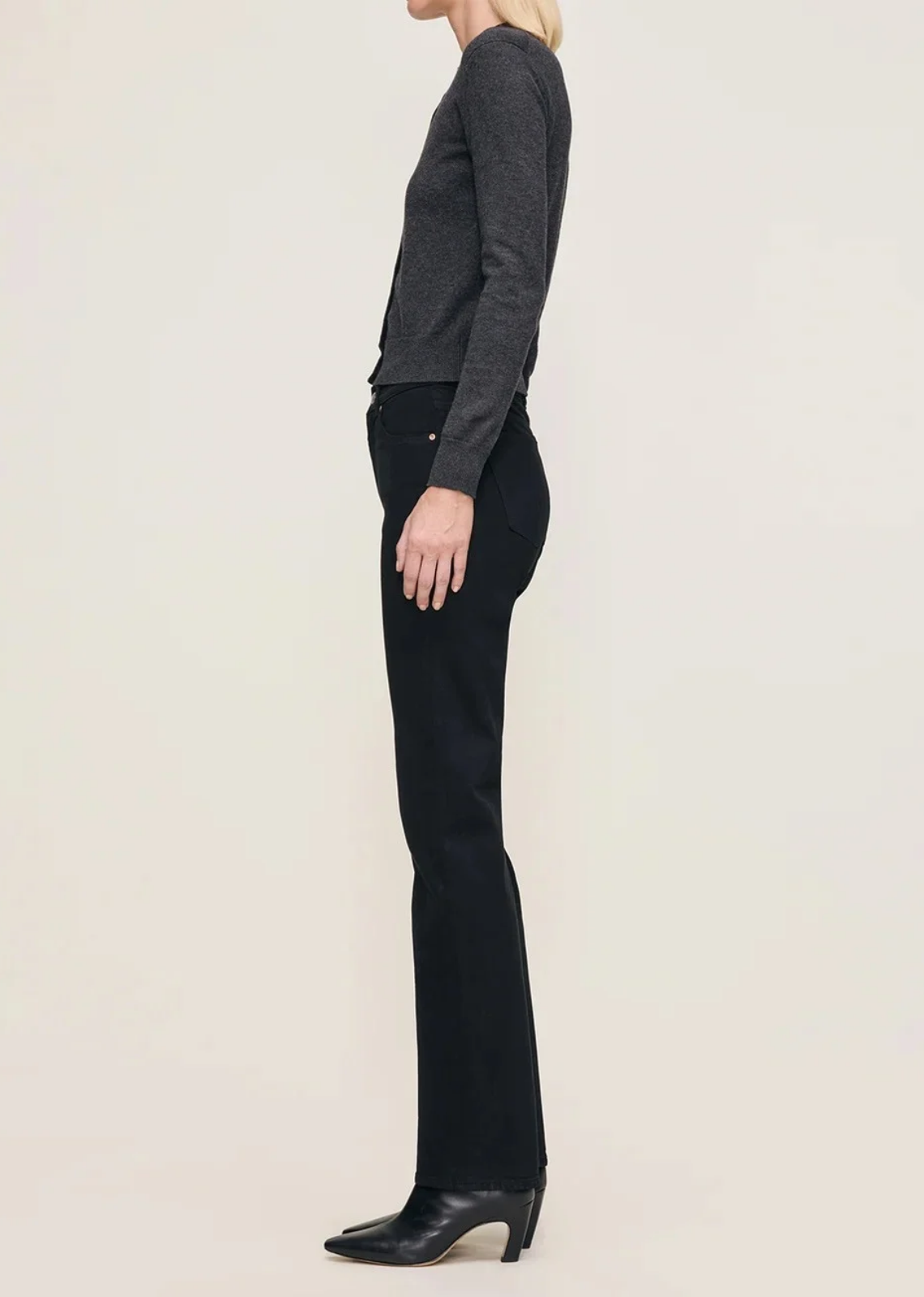 Patti high-rise vintage straight-leg jeans in true black denim, featuring a relaxed fit through the leg, five-pocket construction, silver shank, copper rivets, tonal stitching, a clean hem, and a black back patch. Made with cotton, recycled cotton, and Lycra for a comfortable touch of stretch, with a 31-inch inseam.