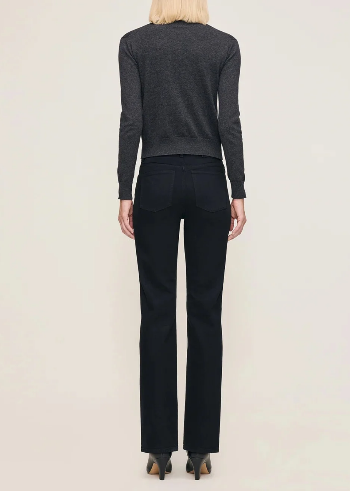 Patti high-rise vintage straight-leg jeans in true black denim, featuring a relaxed fit through the leg, five-pocket construction, silver shank, copper rivets, tonal stitching, a clean hem, and a black back patch. Made with cotton, recycled cotton, and Lycra for a comfortable touch of stretch, with a 31-inch inseam.
