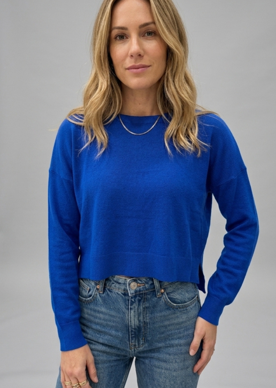 Introducing the Polly Sweater in Deep Blue, a timeless layering essential designed for effortless everyday elegance. Featuring a refined silhouette, this versatile knit transitions seamlessly from casual weekend styling to polished weekday looks. The rich deep blue hue adds a sophisticated touch to any wardrobe, while the quality construction provides lasting comfort and durability. Perfect worn on its own or layered with your favourite pieces, the Polly Sweater is a classic staple you'll reach for season a