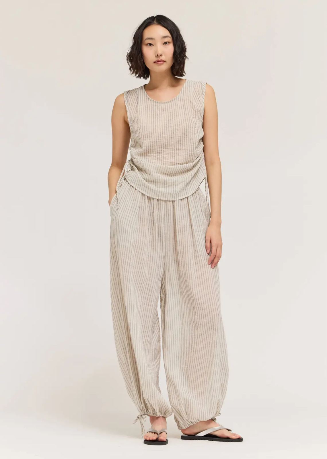 Designed with effortless style and everyday comfort in mind, these pleated waist balloon pants feature a relaxed silhouette that tapers gently at the ankle for a modern, flattering shape. Soft front pleats add subtle structure, while the easy fit offers all-day wearability.
