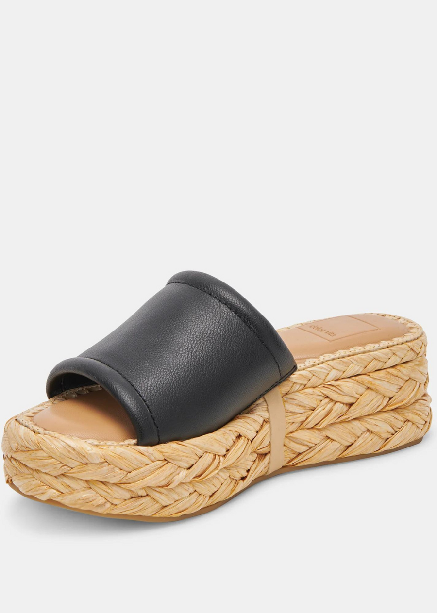 Dolce Vita Chavi Sandal- Black Leather. CHAVI is PTO ready. This slip-on sandal is designed with an espadrille-inspired, textured platform sole. Pack these in your carry-on and your daytime looks are covered.