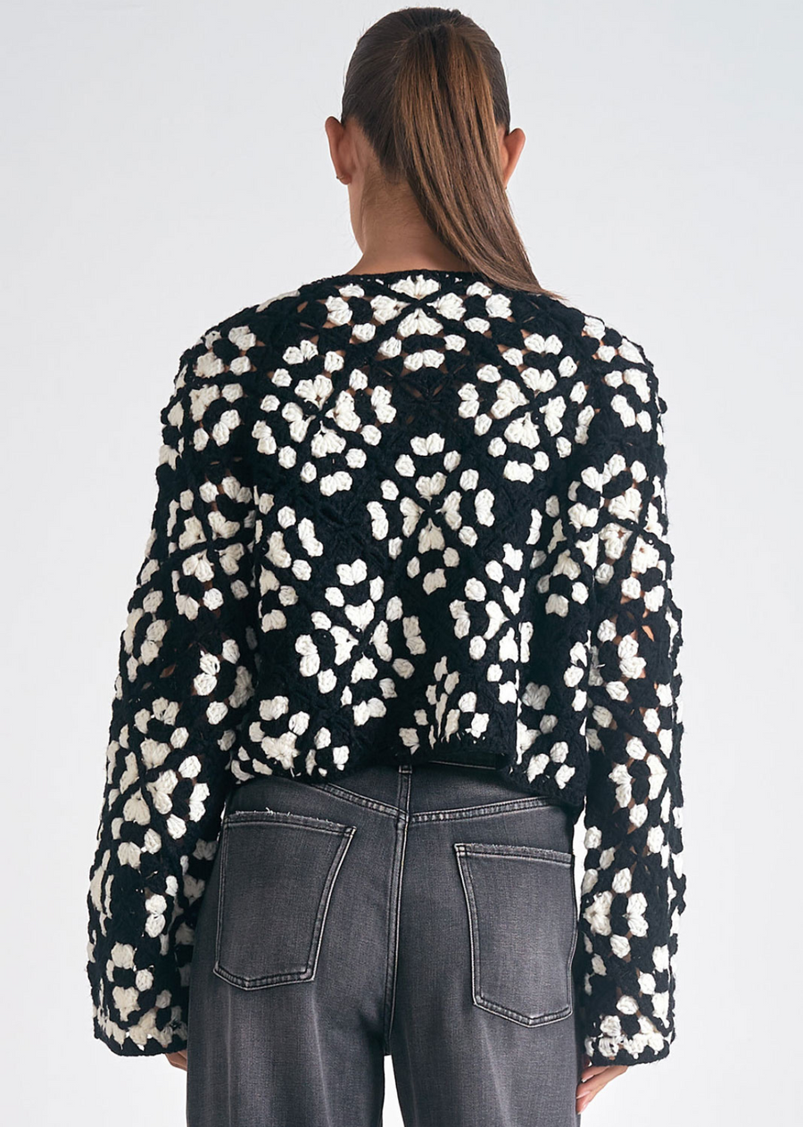 Elan Crochet Cardigan. Our Elan Crochet Cardigan will get you ready for the transitioning weather with the lightweight knit, bell sleeves, and a cropped look perfect to dress up or down! Become a trendsetter with this adorable crochet cardigan.&nbsp;