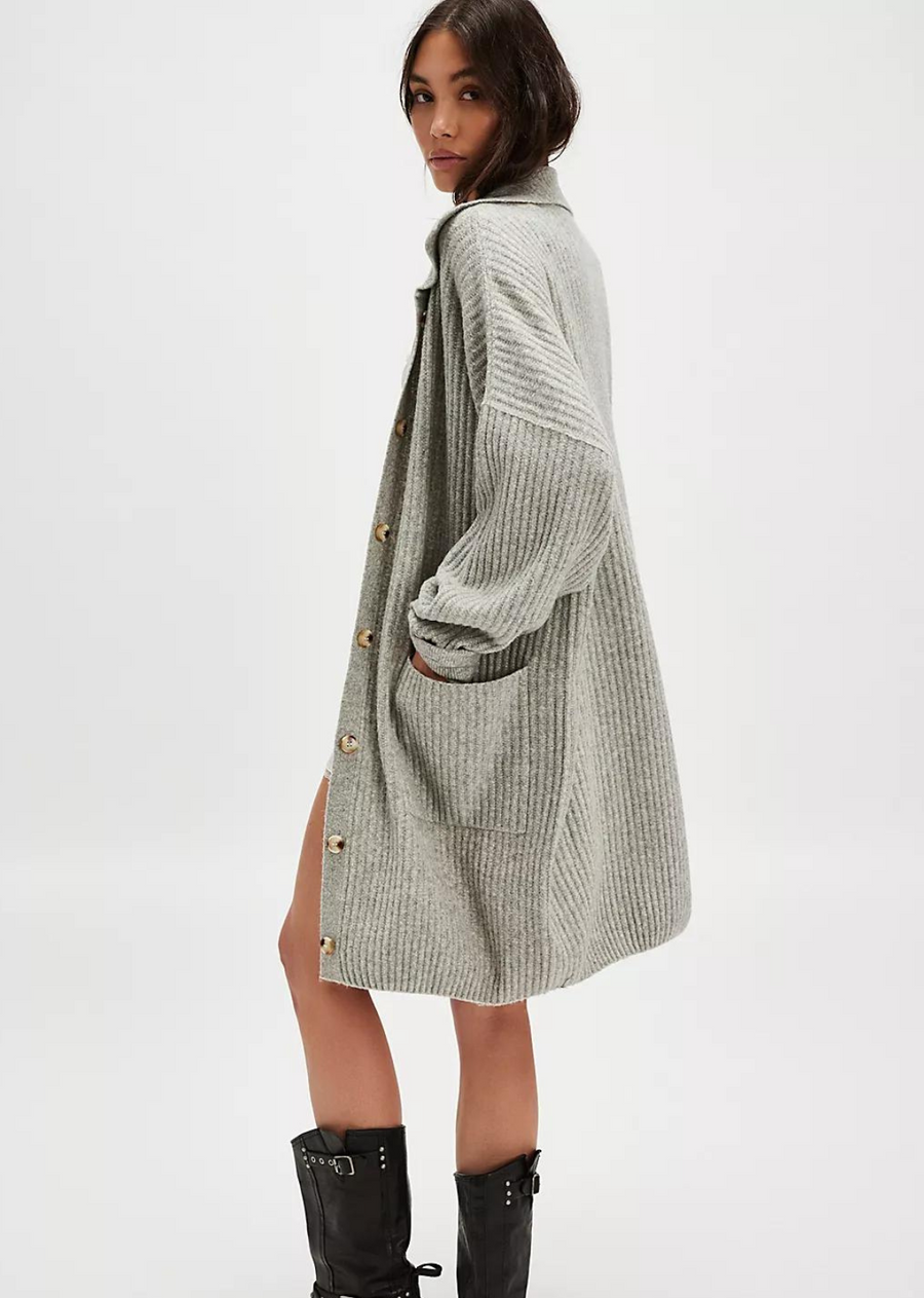 Free People Emmy Cardi. Essential to every collection of layers, this classic cardi is featured in a soft ribbed knit fabrication and slouchy silhouette with button-front closures and a collared-neckline.