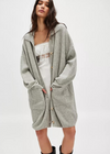 Free People Emmy Cardi. Essential to every collection of layers, this classic cardi is featured in a soft ribbed knit fabrication and slouchy silhouette with button-front closures and a collared-neckline.