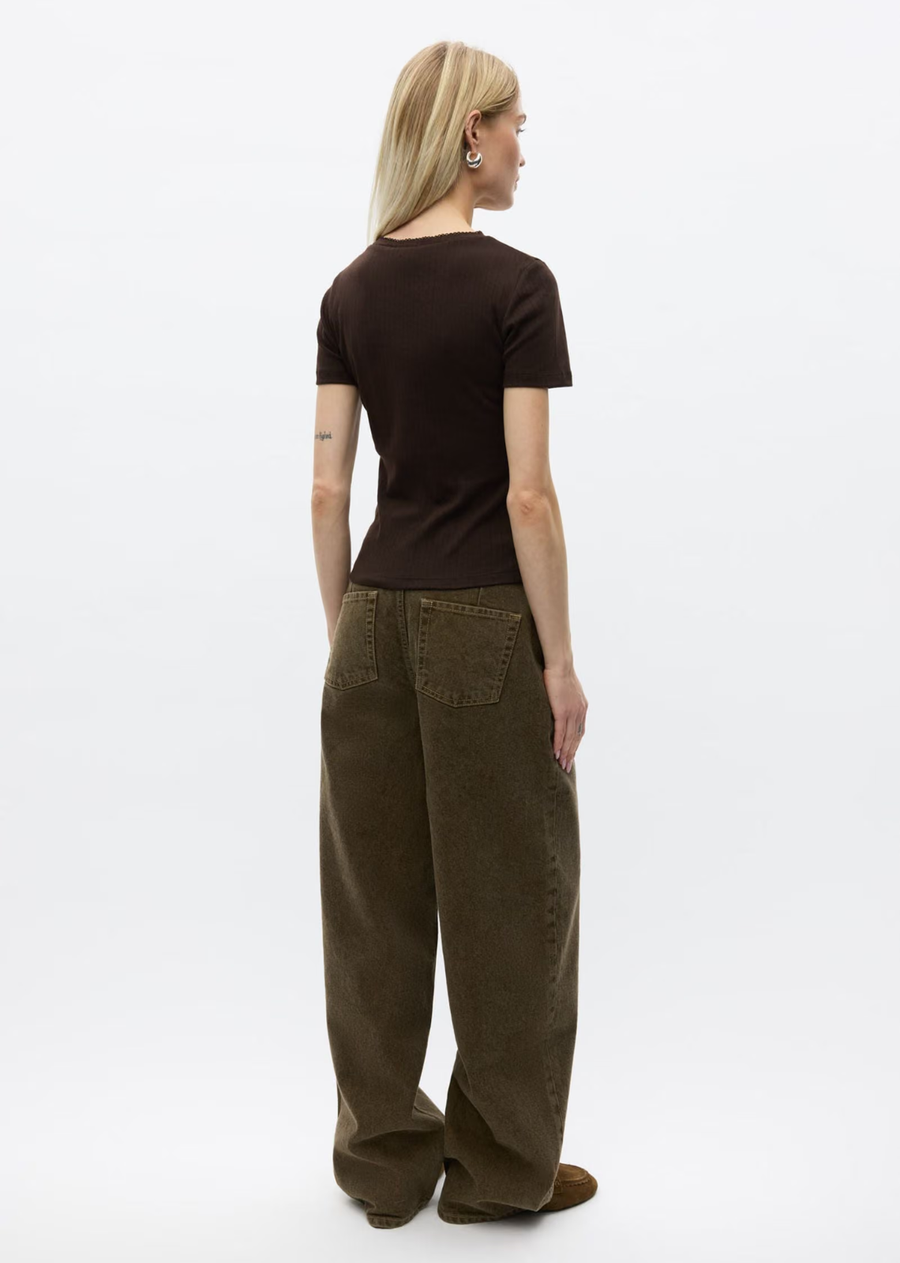 Chocolate Brown Short-sleeved pointelle tee. Soft and stretchy organic cotton with delicate pointelle pattern. Round neck with ribbed trim. Twin needle stitching at sleeves and bottom hem. Slim fit.