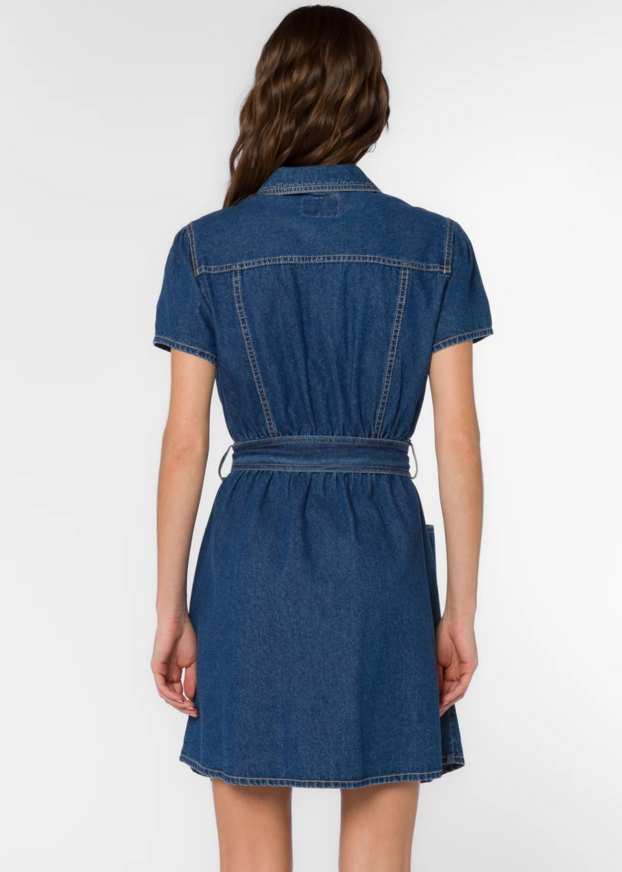 Velvet Heart Fonda Vintage Blue Dress. The Fonda Dress&nbsp;in<span>&nbsp;</span><span>Vintage Blue denim has</span>&nbsp;short cap sleeves and metal snaps button-up with a self belt to cinch the waist for a flattering silhouette. Plenty of pockets and contrasting top-stitching completes the look.