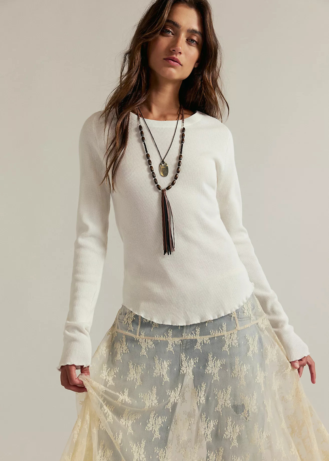 So essential from our We The Free collection, this long-sleeve is featured in a soft waffle-knit fabrication and relaxed fit with raglan-cut sleeves and lettuce-edge trim.