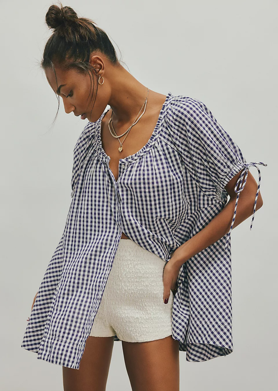 Add instant charm to any look with this sweet tunic top, featuring a floaty silhouette and puffed sleeves, finished with a button closure for endless ways to wear.