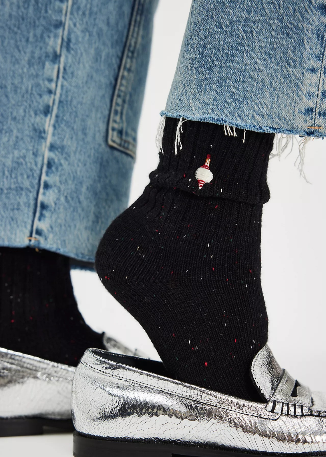 Great for gifting or gracing your own accessories collection, this forever classic sock pack features three pairs of crew style socks designed in a speckled, ribbed knit fabrication with seasonal embroidery at top for the perfect special finish.