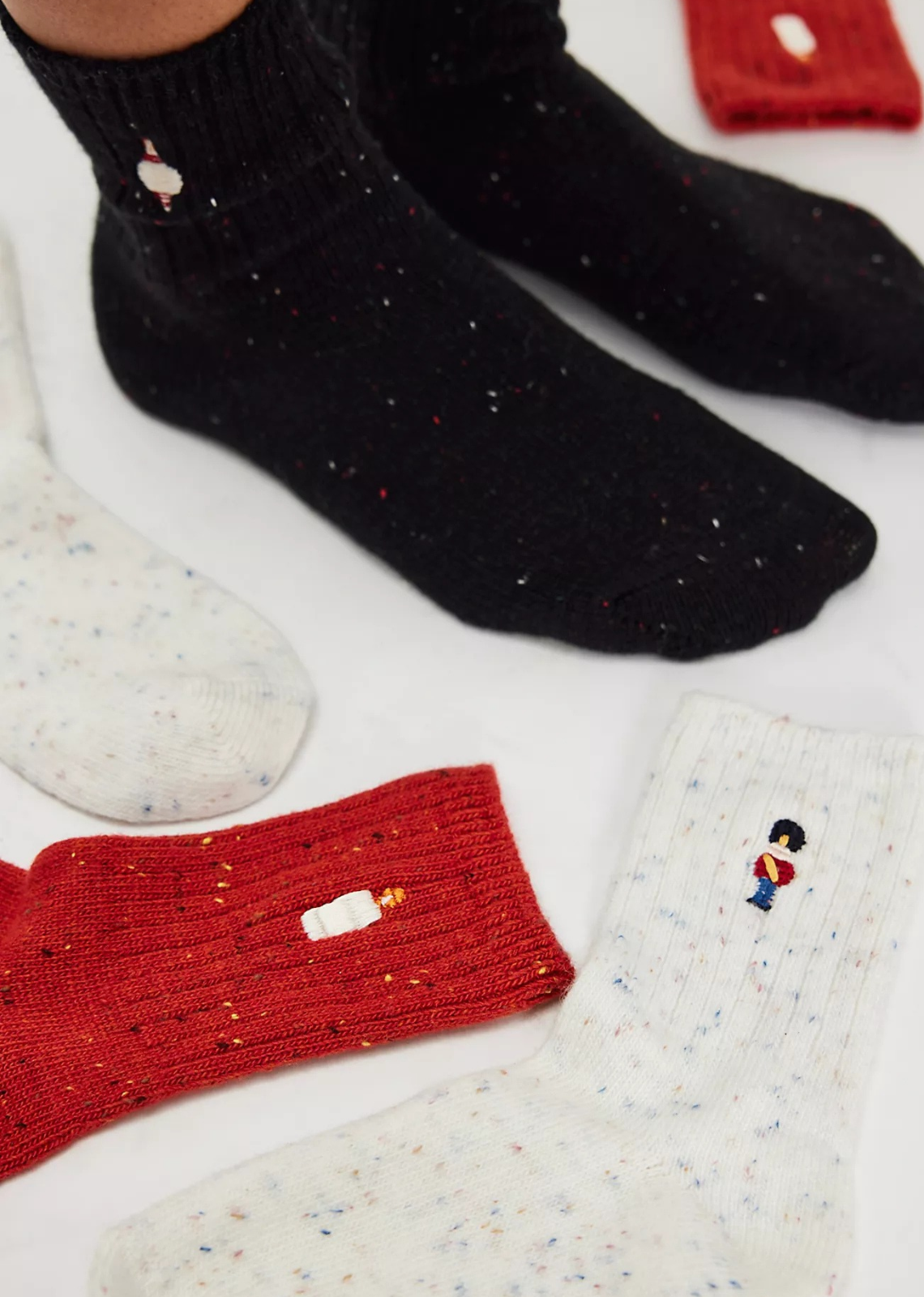 Great for gifting or gracing your own accessories collection, this forever classic sock pack features three pairs of crew style socks designed in a speckled, ribbed knit fabrication with seasonal embroidery at top for the perfect special finish.