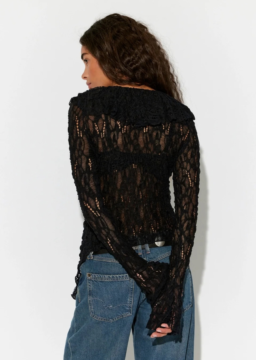 Cascading ruffles and an intricate knit fabrication make this cardigan an absolute head-turner.