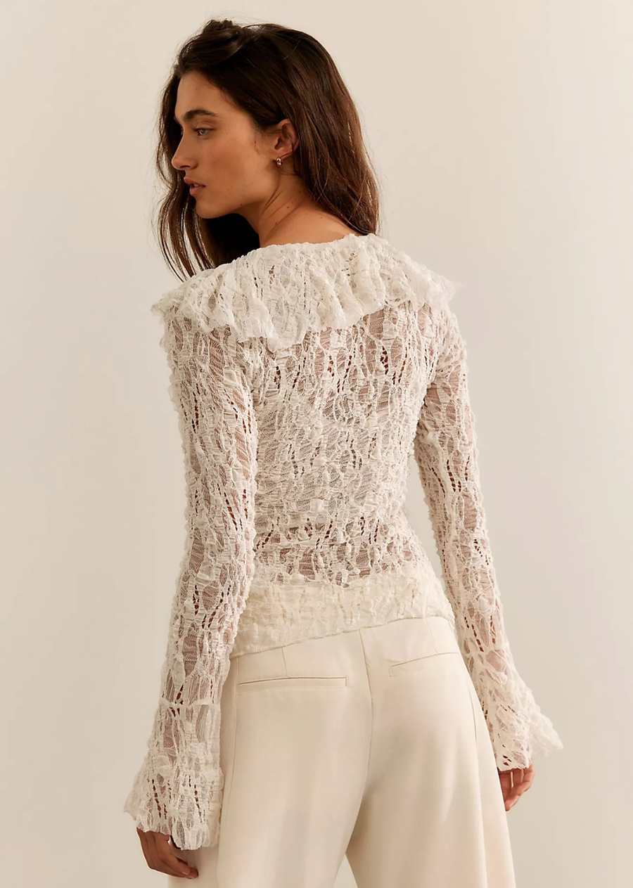 Cascading ruffles and an intricate knit fabrication make this cardigan an absolute head-turner.